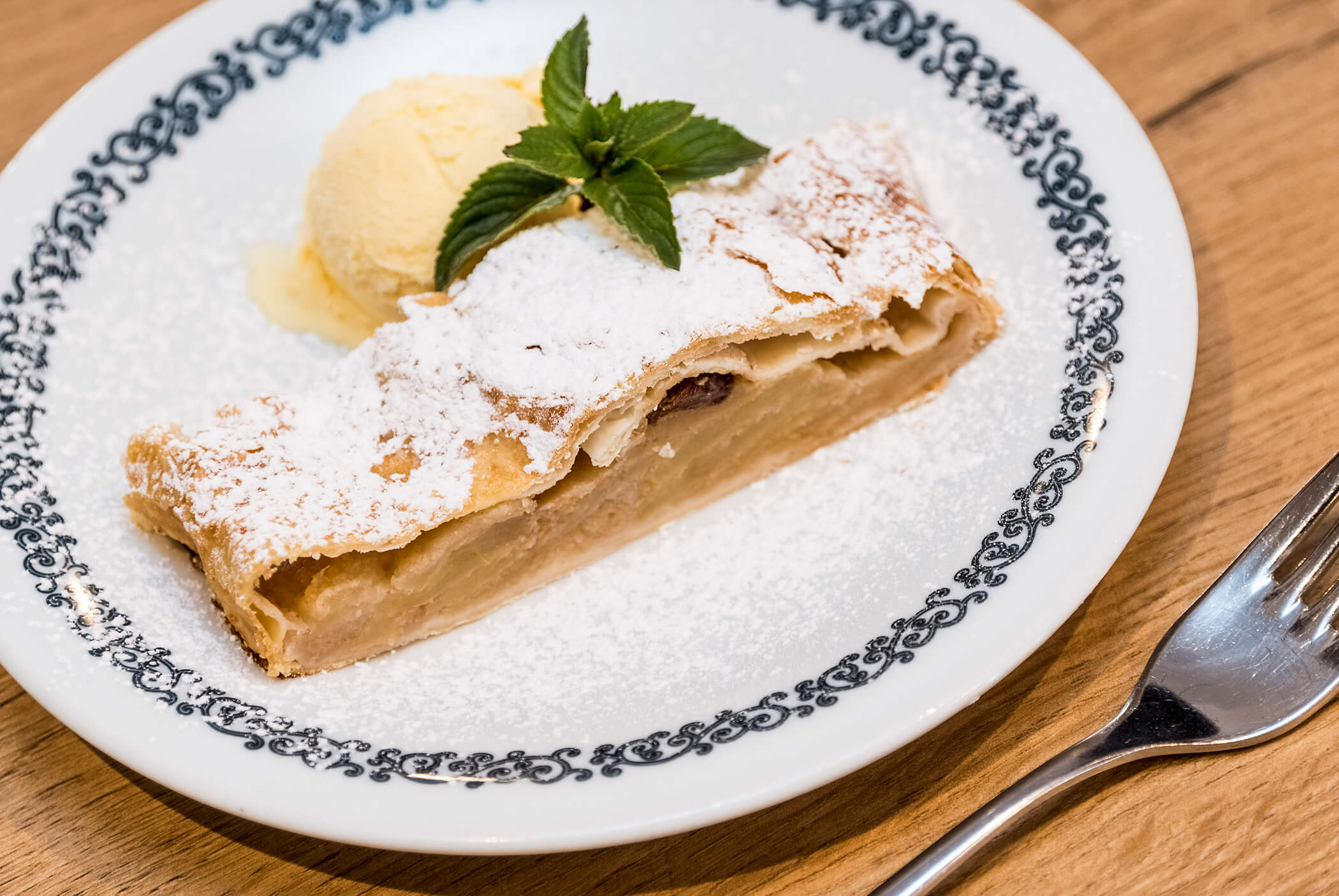 Apple strudel with a scoop of vanilla ice cream - Schirmerhof