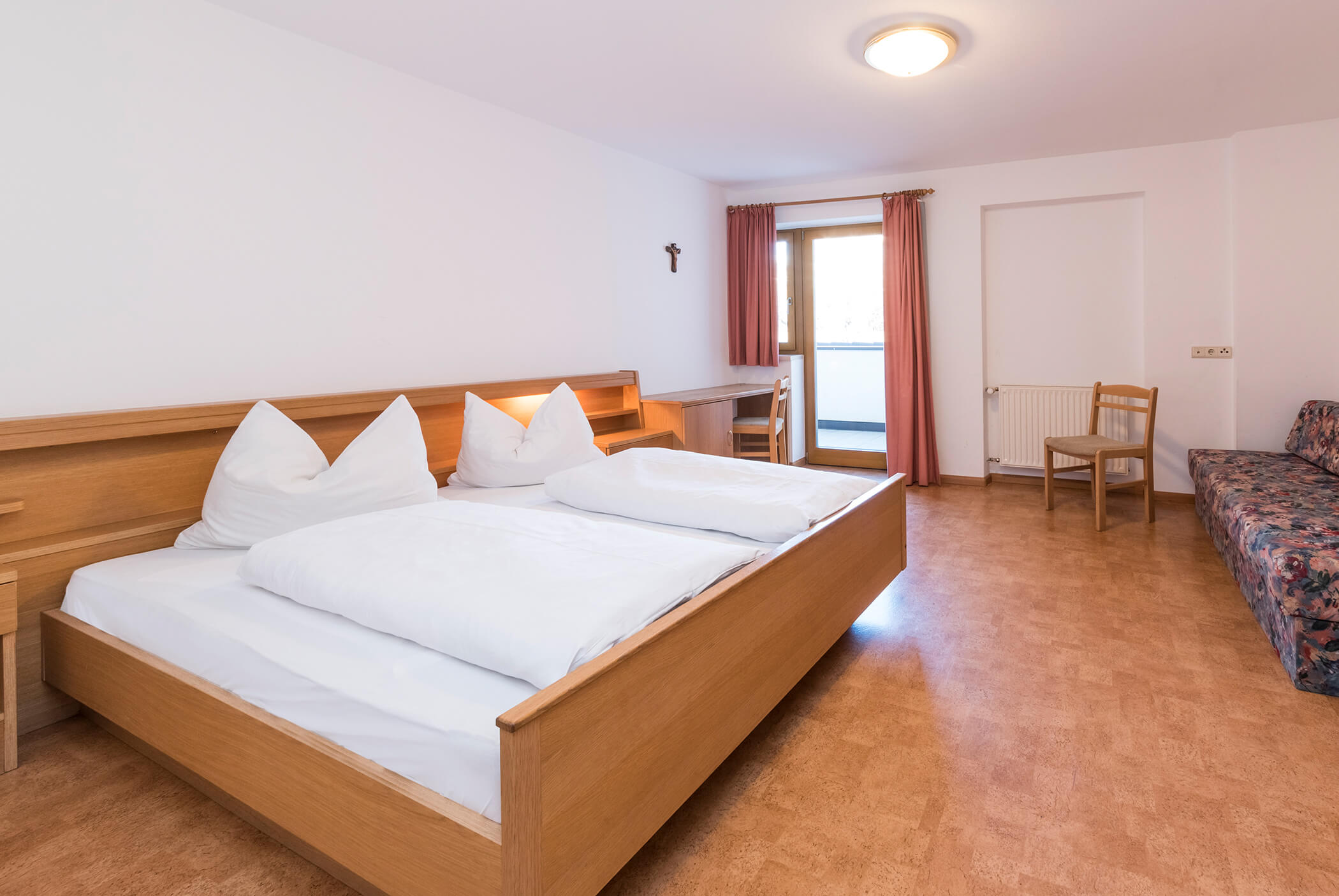 Bedroom with double bed, sofa and chair - Schirmerhof